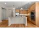 Modern kitchen with granite island and stainless steel appliances at 9823 Sw 95Th Loop, Ocala, FL 34481