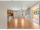 Bright living room with hardwood floors and access to screened porch at 9823 Sw 95Th Loop, Ocala, FL 34481