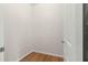 Empty storage room with hardwood floors and neutral walls at 9823 Sw 95Th Loop, Ocala, FL 34481