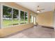 Spacious screened porch with view of lush green landscape at 9823 Sw 95Th Loop, Ocala, FL 34481