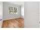 Bright bedroom with hardwood floors and large window at 9823 Sw 95Th Loop, Ocala, FL 34481
