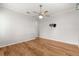 Bedroom with hardwood floors, ceiling fan, and ample natural light at 9823 Sw 95Th Loop, Ocala, FL 34481