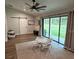 Spacious playroom with a ceiling fan, sliding doors, and plenty of natural light at 1965 County Road 243C, Wildwood, FL 34785