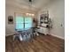 Bright dining room featuring a farmhouse table and ample natural light at 1965 County Road 243C, Wildwood, FL 34785