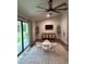 Spacious playroom with a ceiling fan, sliding doors, and plenty of natural light at 1965 County Road 243C, Wildwood, FL 34785