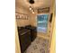 Convenient laundry room with washer, dryer, and stylish tile floor at 1965 County Road 243C, Wildwood, FL 34785