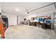 Attached garage with ample space for vehicles, storage, and workshop at 8924 Sw 76Th Ln, Ocala, FL 34481