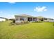 Large backyard with lush landscaping and screened patio at 8924 Sw 76Th Ln, Ocala, FL 34481
