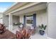 Relaxing front porch with wicker chairs and lush landscaping at 8924 Sw 76Th Ln, Ocala, FL 34481