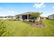 Landscaped backyard with a view of the house at 8924 Sw 76Th Ln, Ocala, FL 34481