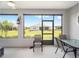 Relaxing screened-in porch overlooking a beautifully landscaped backyard at 8924 Sw 76Th Ln, Ocala, FL 34481