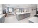 Open kitchen with island and stainless steel appliances at 8924 Sw 76Th Ln, Ocala, FL 34481