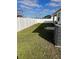 Backyard with grass, privacy fence, and AC unit at 8314 Sw 59Th Ter, Ocala, FL 34476