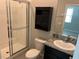 Bathroom with shower, granite vanity, and storage at 8314 Sw 59Th Ter, Ocala, FL 34476