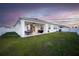 Covered patio with seating area overlooking a spacious grassy backyard at 8314 Sw 59Th Ter, Ocala, FL 34476
