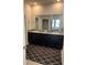 Double vanity bathroom with dark brown cabinets at 8314 Sw 59Th Ter, Ocala, FL 34476