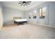 Spacious bedroom with carpet, ceiling fan and large windows at 8314 Sw 59Th Ter, Ocala, FL 34476
