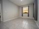 Bright bedroom with tile floors and sunset view at 8314 Sw 59Th Ter, Ocala, FL 34476