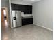 Compact kitchenette with stainless steel appliances at 8314 Sw 59Th Ter, Ocala, FL 34476