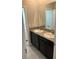 Double sink bathroom with dark brown cabinets at 8314 Sw 59Th Ter, Ocala, FL 34476