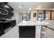 Open concept kitchen with island and stainless steel appliances at 8314 Sw 59Th Ter, Ocala, FL 34476