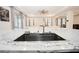 Modern kitchen island with a large sink and granite countertop at 8314 Sw 59Th Ter, Ocala, FL 34476