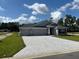 Newly built home with three-car garage and stone accents at 7160 Sw 179Th Court Rd, Dunnellon, FL 34432