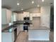 Modern kitchen with island, stainless steel appliances, and granite countertops at 7160 Sw 179Th Court Rd, Dunnellon, FL 34432
