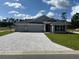 Newly built home with three-car garage and stone accents at 7160 Sw 179Th Court Rd, Dunnellon, FL 34432