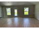 Bright and spacious living room with tile flooring and multiple windows at 7160 Sw 179Th Court Rd, Dunnellon, FL 34432
