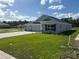 Newly built home with three-car garage and stone accents at 7160 Sw 179Th Court Rd, Dunnellon, FL 34432