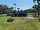 Serene water feature with a waterfall and lush landscaping at 7160 Sw 179Th Court Rd, Dunnellon, FL 34432