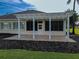 Spacious covered patio with pavers, perfect for outdoor entertaining at 9240 Se 128Th Ln, Summerfield, FL 34491