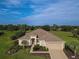 Luxury home on a golf course with spacious landscaping at 9240 Se 128Th Ln, Summerfield, FL 34491