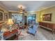 Spacious living room featuring comfortable seating and large windows at 9240 Se 128Th Ln, Summerfield, FL 34491
