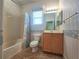 Clean bathroom with shower/tub combo and vanity at 9240 Se 128Th Ln, Summerfield, FL 34491
