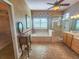 Bathroom features a large soaking tub, walk-in shower, and access to walk-in closet at 9240 Se 128Th Ln, Summerfield, FL 34491