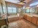 Elegant bathroom with double vanity, soaking tub, and walk-in shower at 9240 Se 128Th Ln, Summerfield, FL 34491