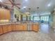 Island kitchen with granite countertops and stainless steel appliances at 9240 Se 128Th Ln, Summerfield, FL 34491