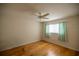 Bright bedroom with hardwood floors and ceiling fan at 9698 Sw 96Th St, Ocala, FL 34481