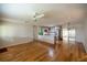 Open living room with hardwood floors and ceiling fan at 9698 Sw 96Th St, Ocala, FL 34481