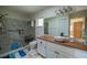 Modern bathroom with a walk-in shower, updated vanity, and stylish tile at 9698 Sw 96Th St, Ocala, FL 34481