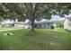 Charming single story home with a large tree and well maintained lawn at 9698 Sw 96Th St, Ocala, FL 34481