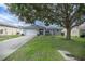 Single-story home with attached garage and mature landscaping at 9698 Sw 96Th St, Ocala, FL 34481