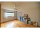 Bright bedroom featuring hardwood floors and ample natural light at 9698 Sw 96Th St, Ocala, FL 34481