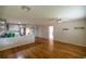 Living area with hardwood floors and kitchen view at 9698 Sw 96Th St, Ocala, FL 34481