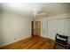 Bedroom with hardwood floors, ceiling fan, and double closet at 9698 Sw 96Th St, Ocala, FL 34481