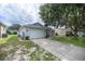 Front view of a single story house with a driveway at 9698 Sw 96Th St, Ocala, FL 34481