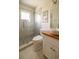 Updated bathroom with a glass shower, modern vanity, and pebble tile floor at 9698 Sw 96Th St, Ocala, FL 34481