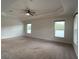 Bright and airy main bedroom with carpeted floor and multiple windows at 4426 Nw 2Nd Ct, Ocala, FL 34475
